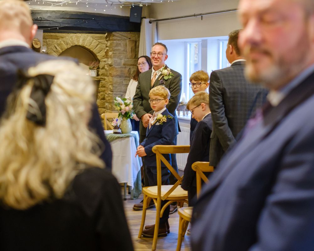 Groom and two sons waiting for mum to come down the aisle at the Black Horse in Clifton