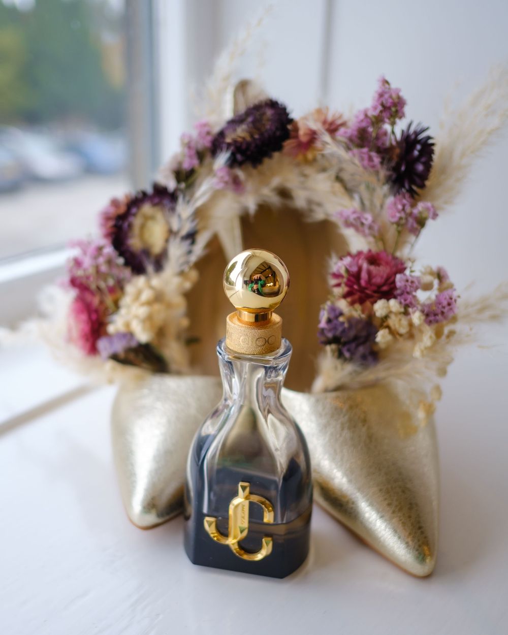 Brides shoes, perfume and floral hair band