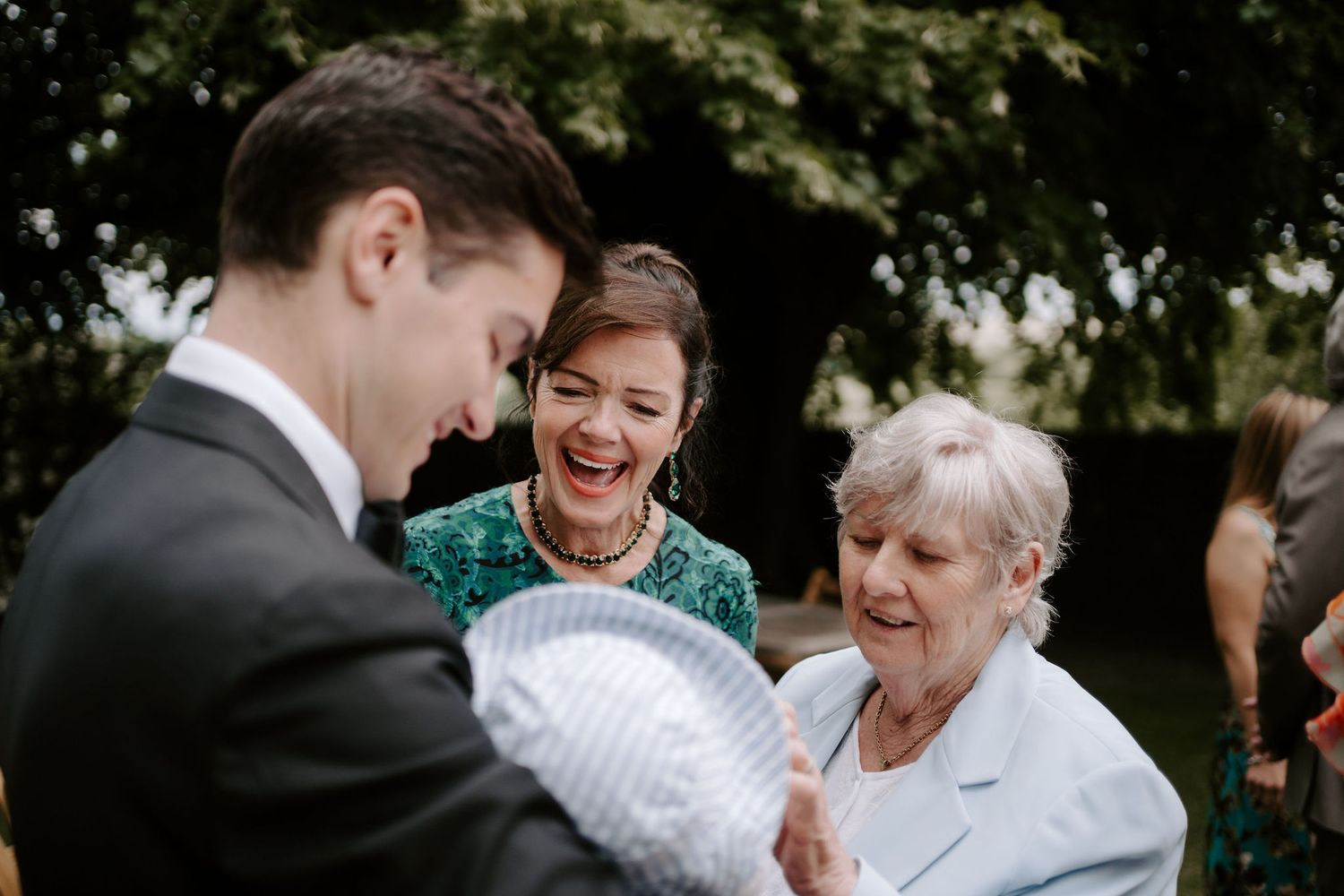 wedding guests talking and laughing at Hamswell house in bath