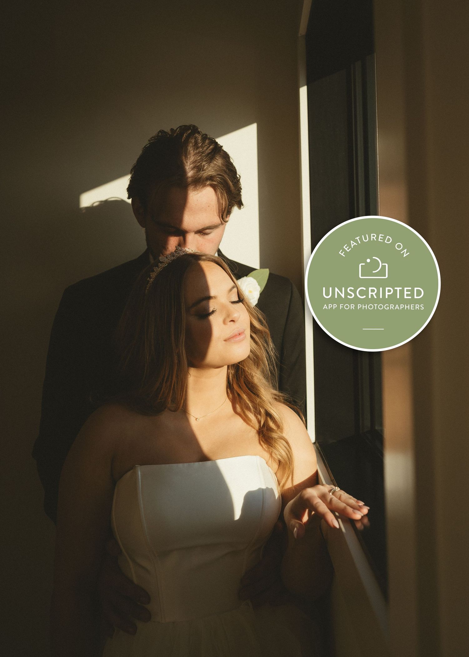 Romantic window light portrait with sun rays and an 'Unscripted' watermark overlay. Unscripted posing app for photographers