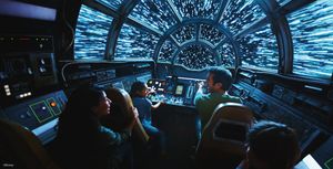 Inside the cockpit of the Millennium Falcon starship from Star Wars as it travels through hyperspace in outer space.