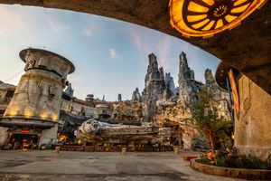 Scenic view of Star Wars: Galaxy's Edge at Disney theme park featuring spires and architectural details at golden hour.
