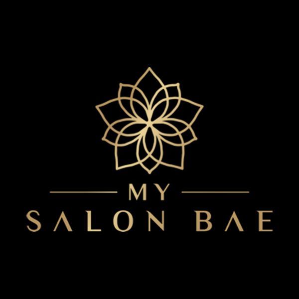 Elegant gold lotus flower logo design for My Salon Bae beauty company on black background.
