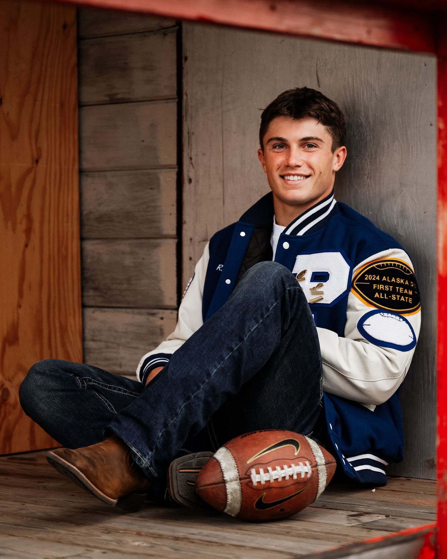 Senior photography session in New Hampshire with football player.
