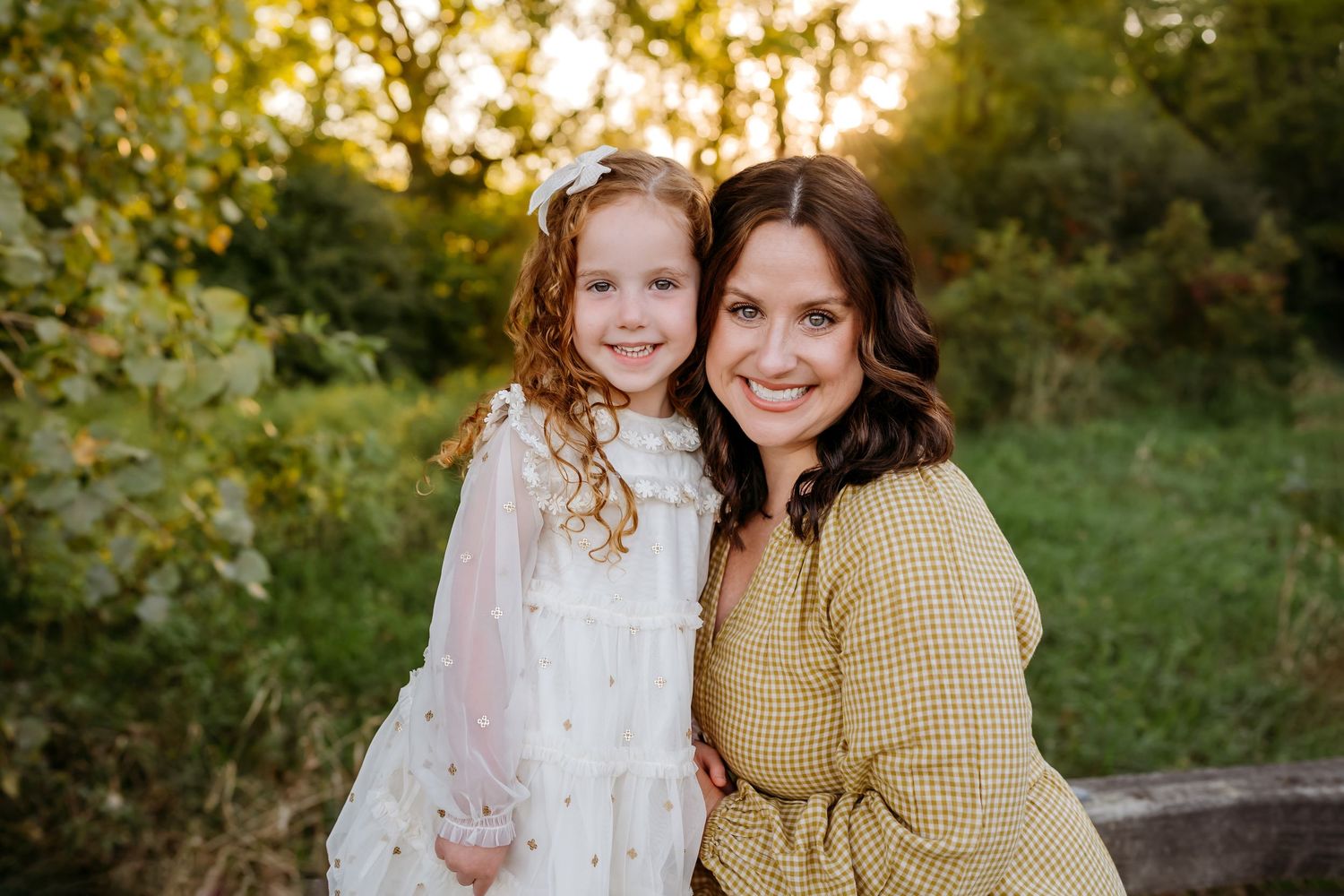 A series of outdoor family portraits captured at golden hour in a natural setting with warm autumn colors and soft lighting.