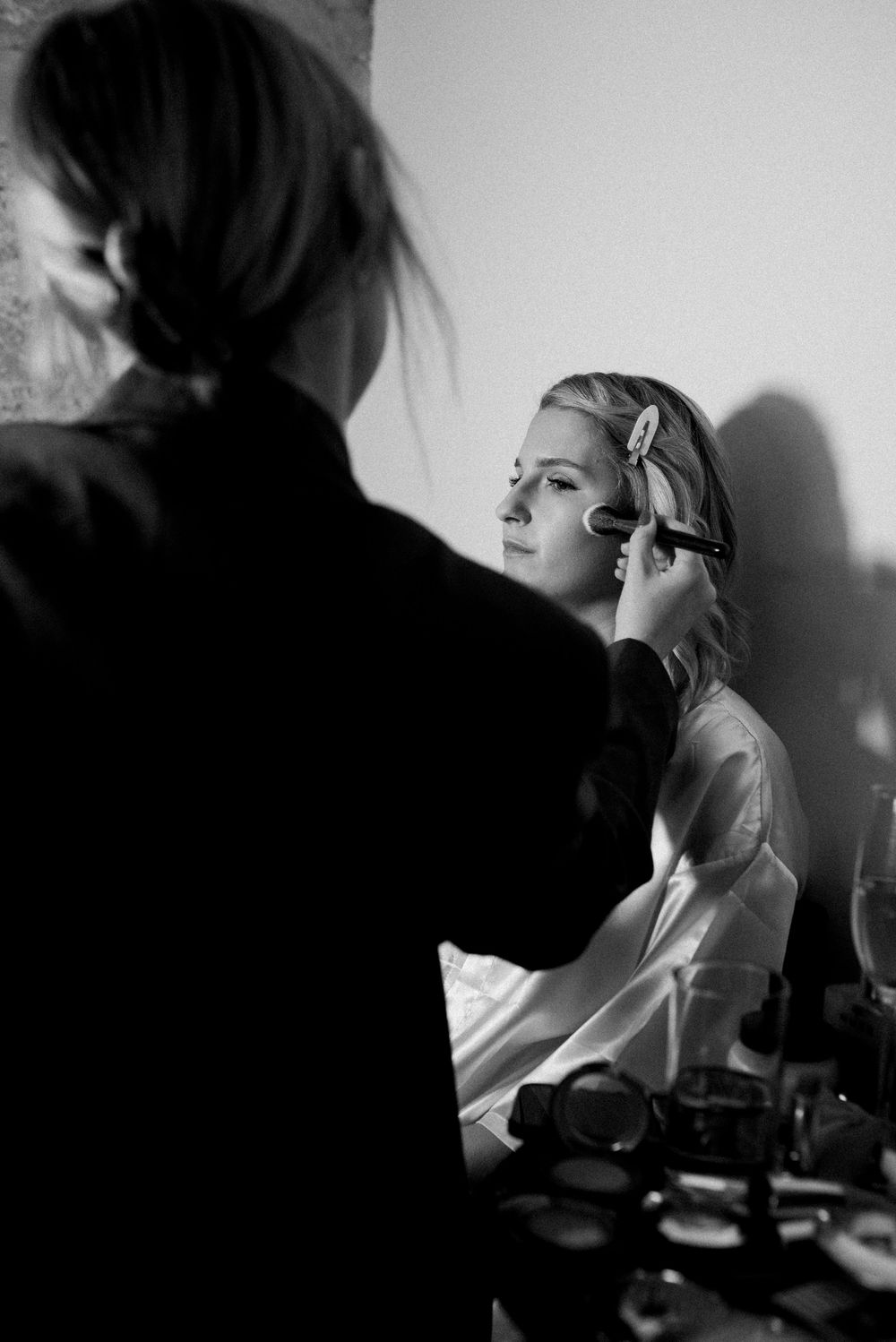 Dramatic black and white profile shots showing preparation in shadow and light.