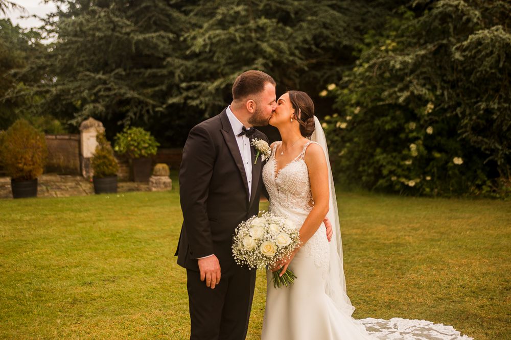 Elegant wedding photos showing couple in traditional attire against natural outdoor backdrop.