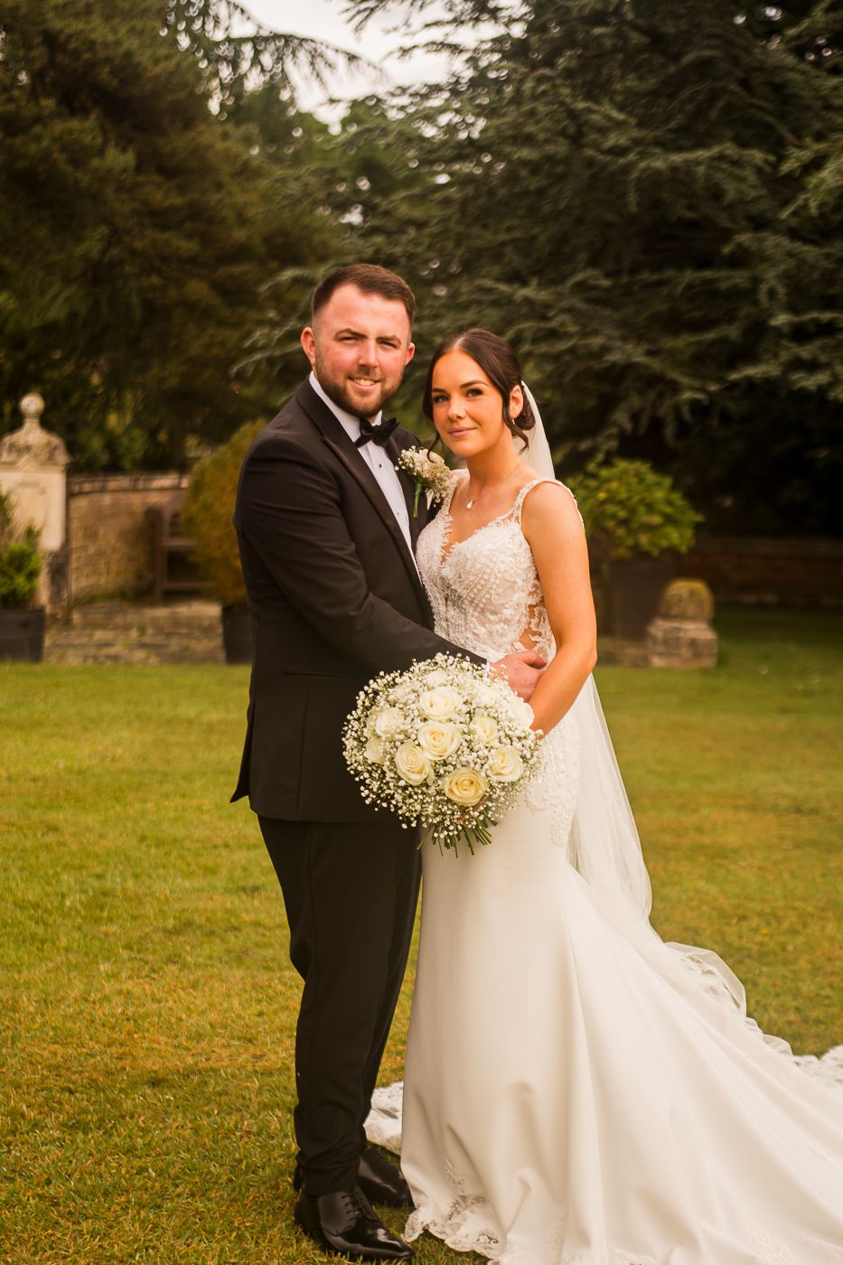 Wedding photo collection showing couple's romantic moments in outdoor garden setting.