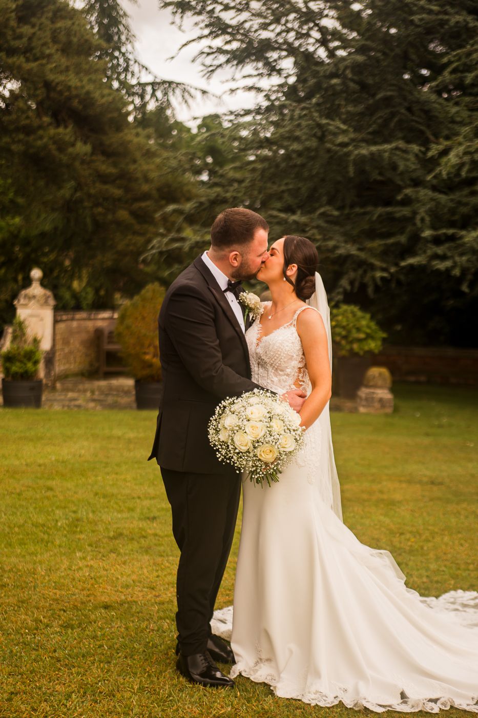Series of intimate wedding portraits captured in golden hour lighting on garden grounds.