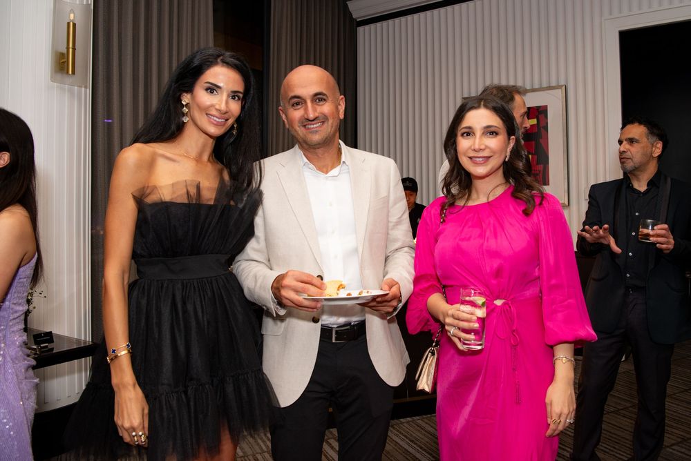 Group of people mingling at a formal event at Boston’s Four Season’s Hotel. This 40th Birthday was photographed by Leah Ramuglia.