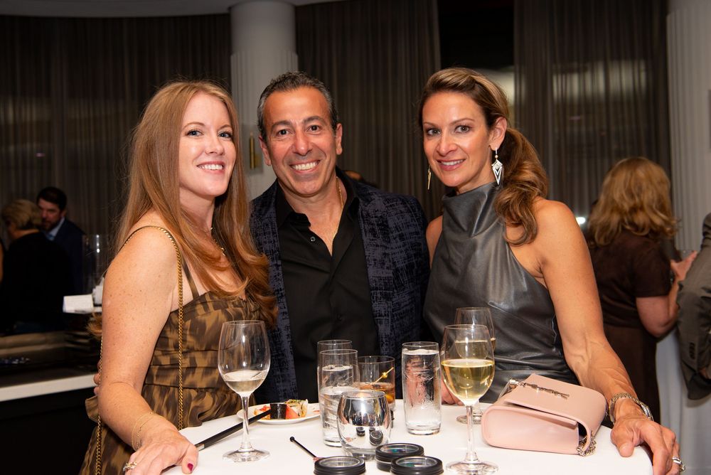 A group of people enjoying One+One Restaurant at an event at the Boston’s Four Season’s Hotel photographed by Leah Ramuglia.