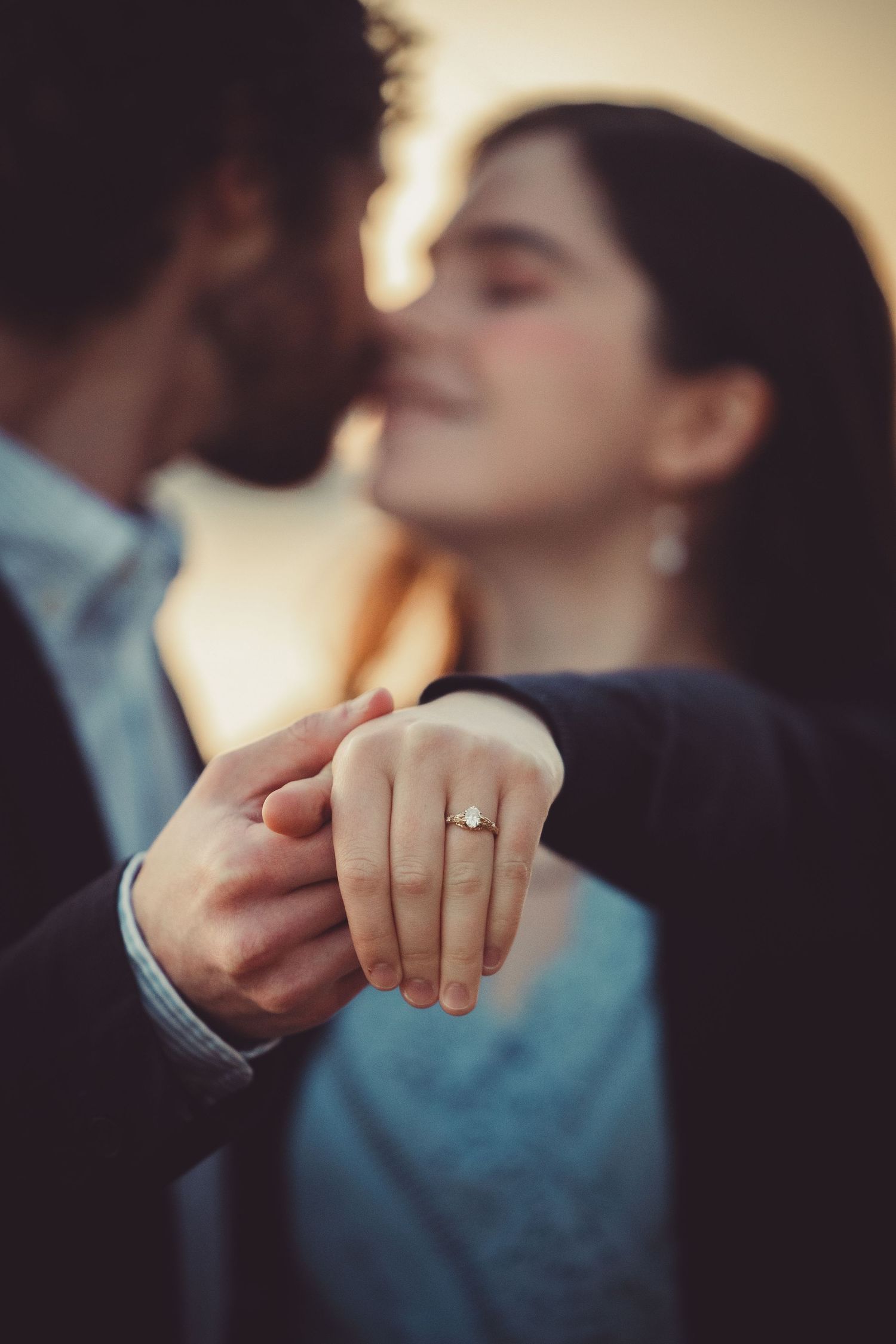 Close-up of engagement ring from Neverland Jewelry sparkling in morning light