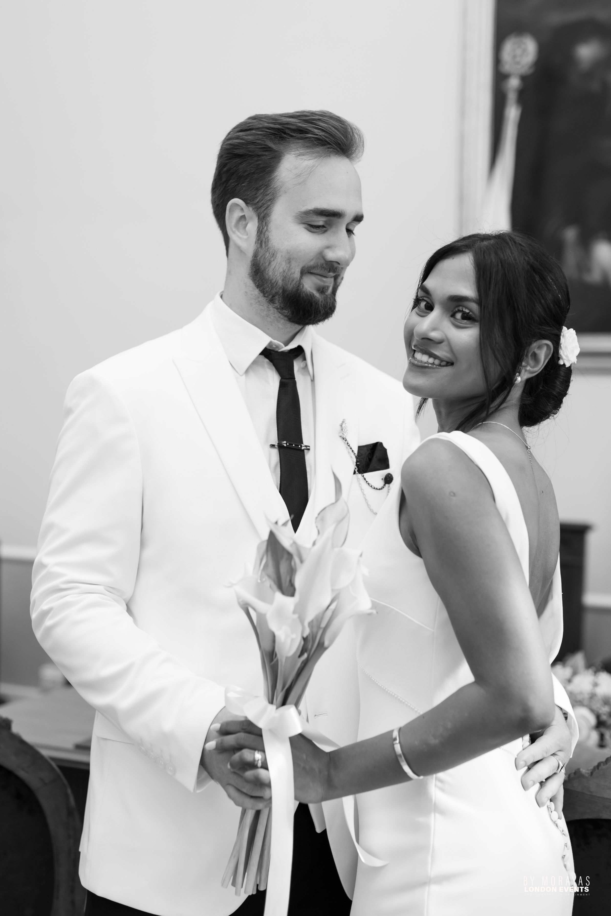 Joyful wedding couple sharing laughs during their dance together.
