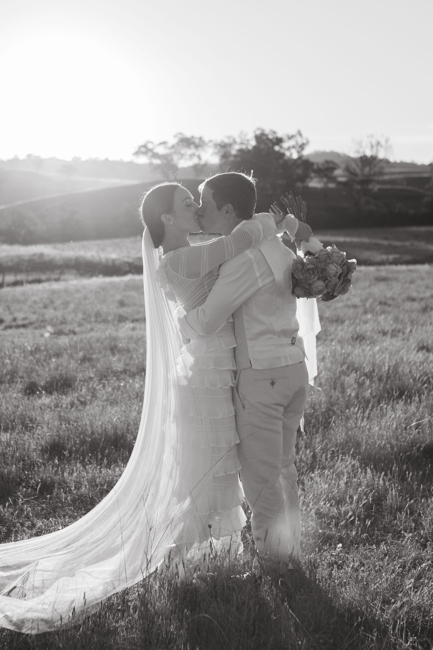Bride and groom kissing at Scone NSW Country wedding