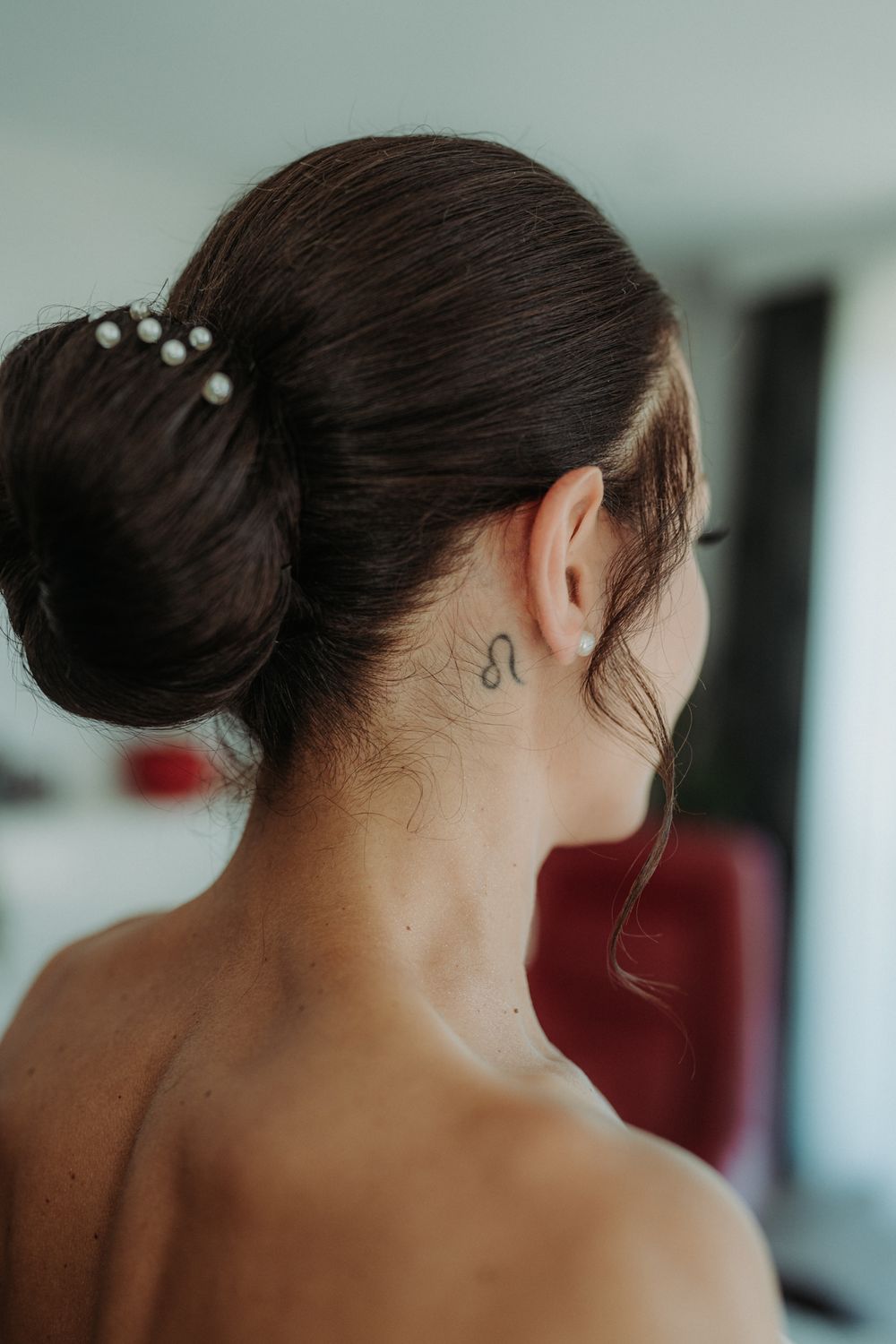 Close-up view of bride's elegant updo hairstyle with delicate hair accessories.