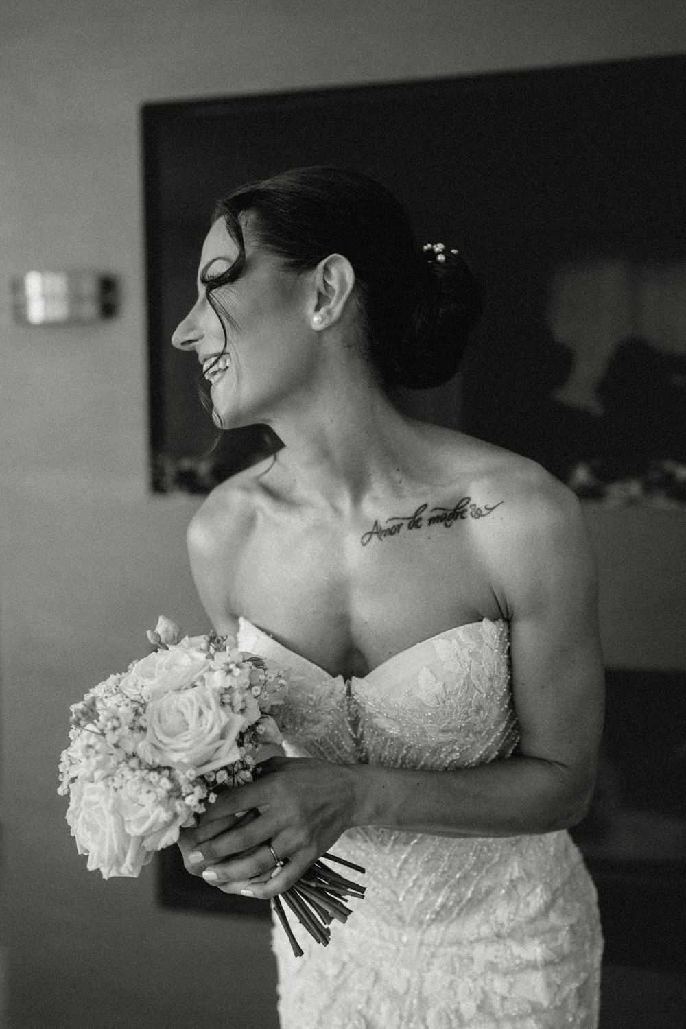 Black and white artistic photo series showing details of a strapless lace wedding dress and white rose bouquet.