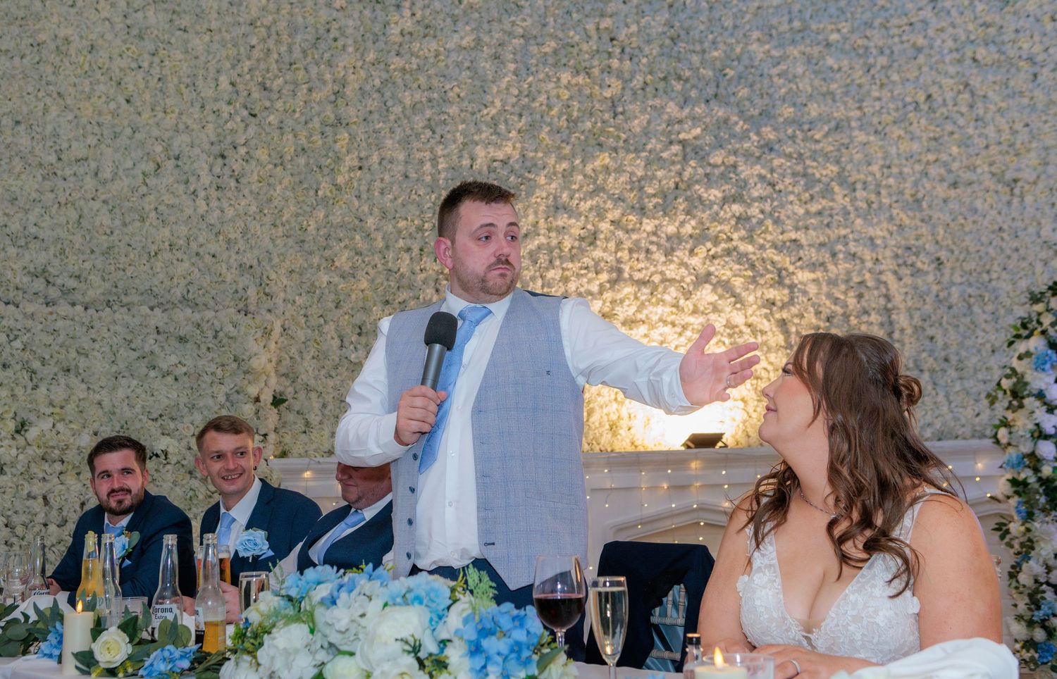 A series of wedding reception photos showing guests dancing, toasting and celebrating at an elegant venue.
