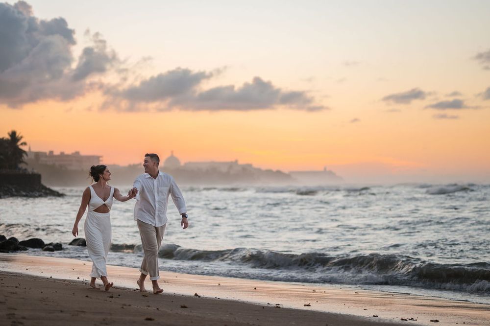 Couple hugging by the water during engagement photos in San Juan Puerto Rico