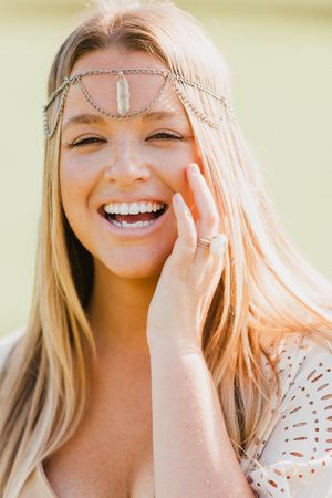 Close-up portraits showcasing a delicate headpiece and natural lighting.