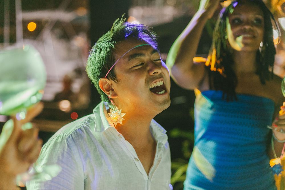 Wedding guests singing at the party.