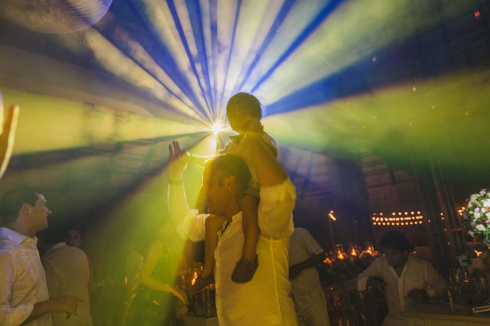 Child wedding guest dancing during wedding ceremony.