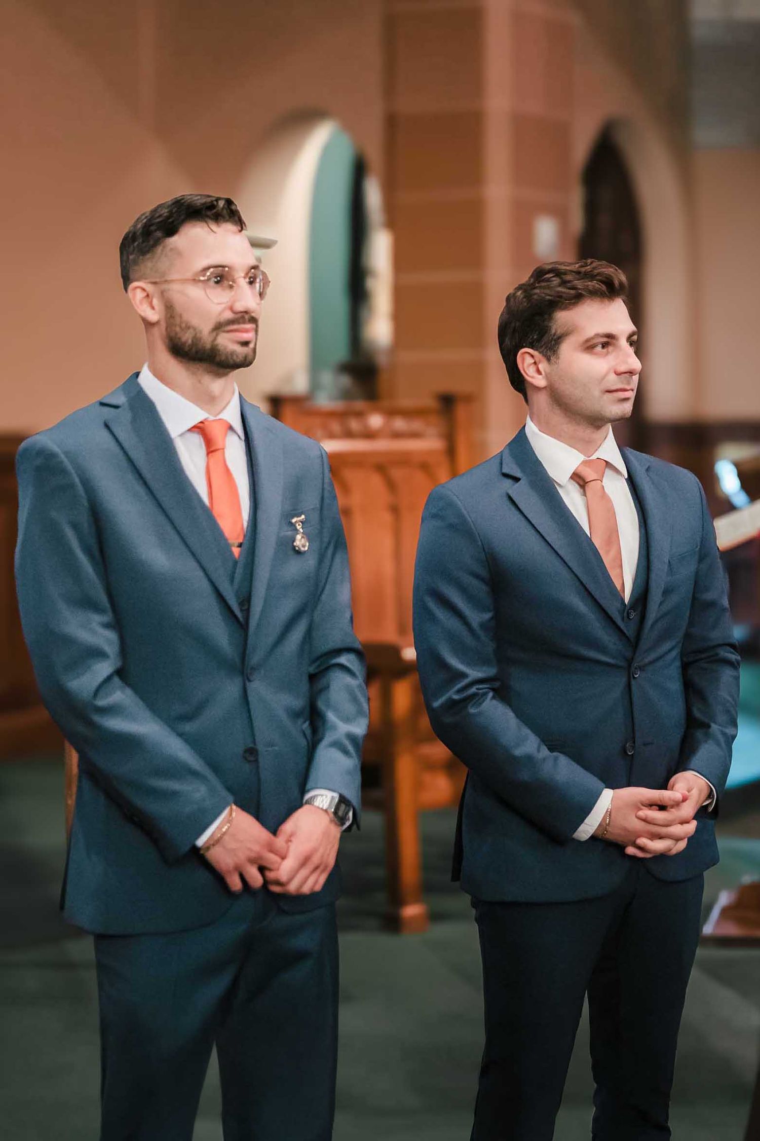 Groom and groomsman standing at the altar inside Saint Brigid Church during a South Boston wedding ceremony