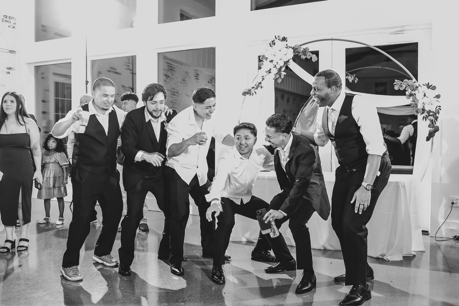 Packed dance floor celebration during spring wedding reception