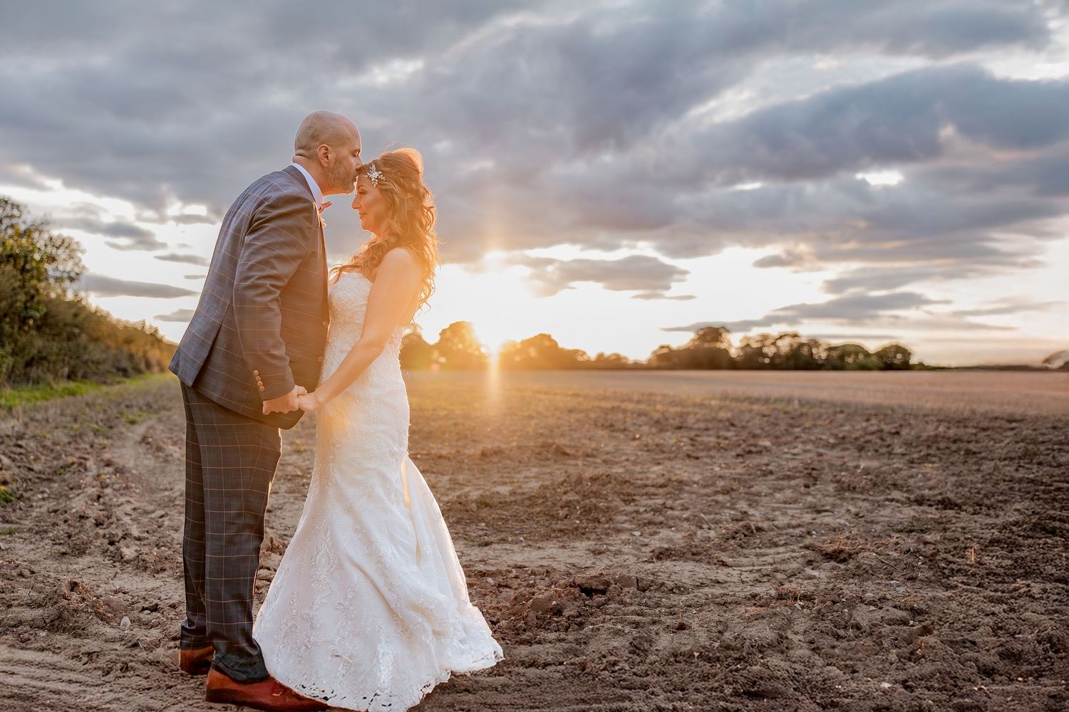 Relaxed sunset couple portrait during a wedding day.