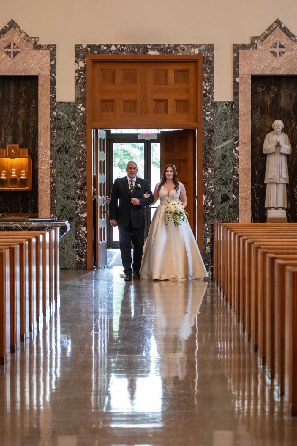 A sequence of wedding ceremony moments showing a couple walking down a church aisle with marble floors and wooden pews.
