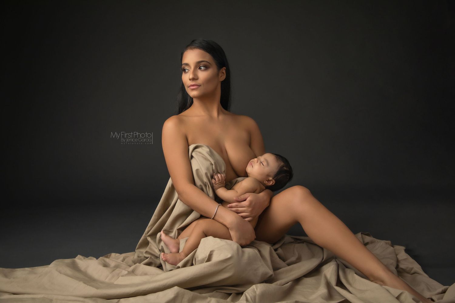Artistic black and white portrait series showing intimate poses with fabric draping and dramatic lighting.
