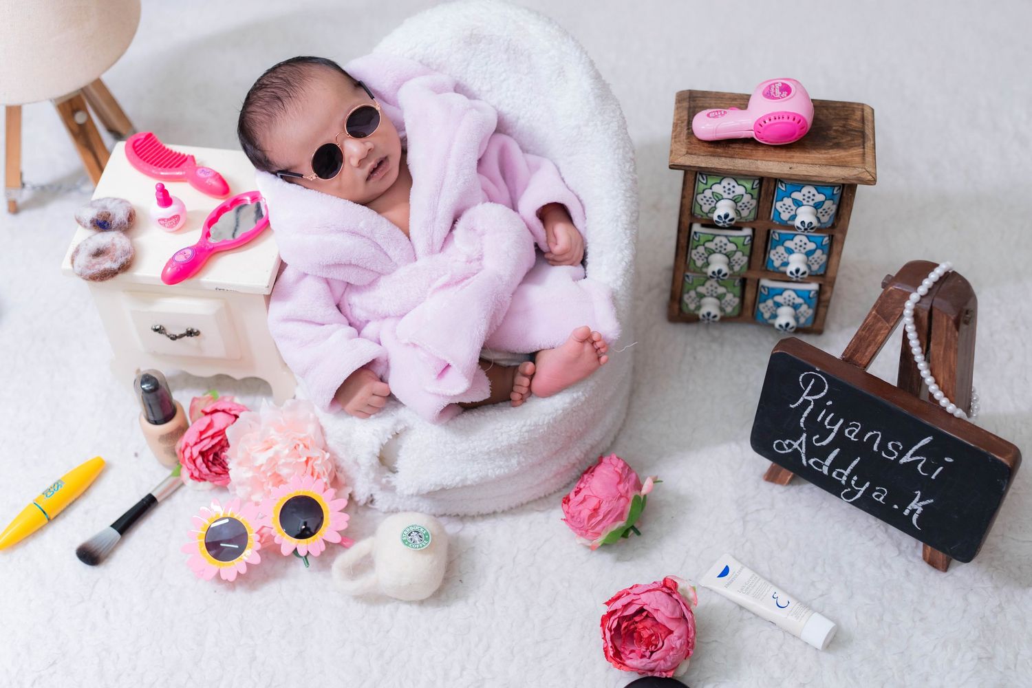 Newborn baby girl photoshoot in Hyderabad studio with themed setup and soft lighting in Manikonda - Bump To Baby by Sai Jyothi