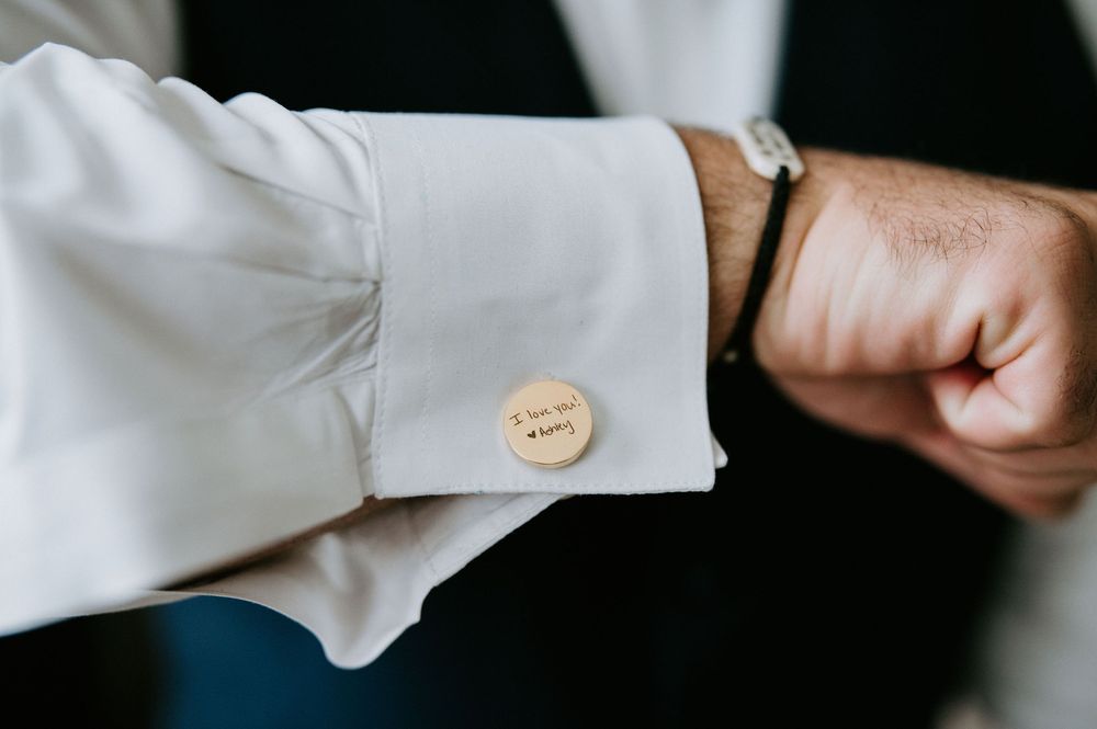 White cuff links are displayed in sequence on a dark background showing various angles and details.