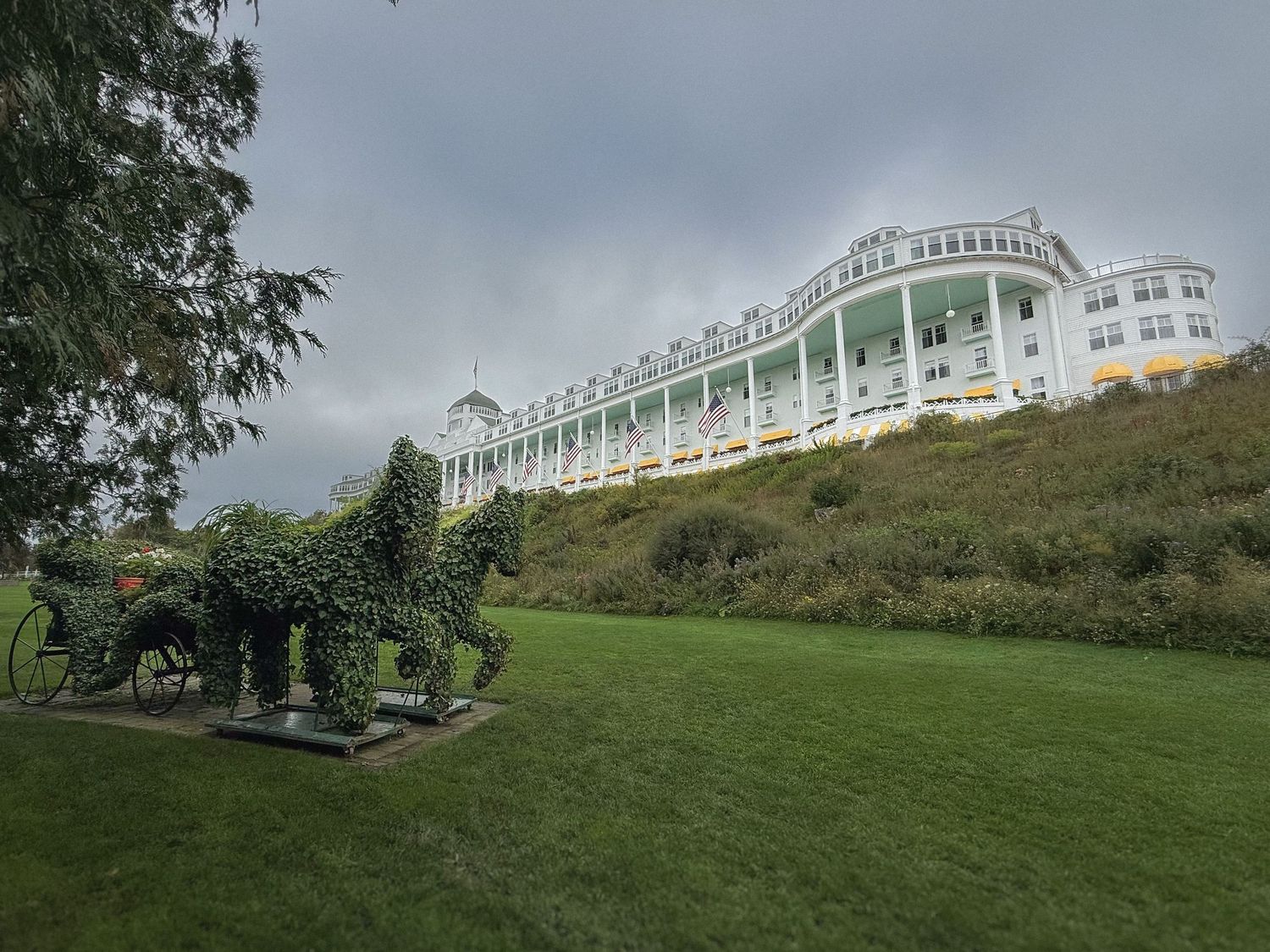 Historic Grand Hotel sits majestically atop Mackinac Island's highest point overlooking the scenic landscape.