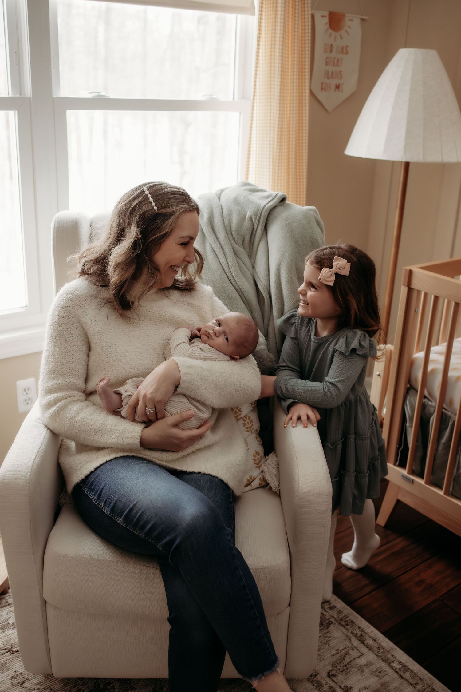 Three intimate moments captured in a nursery as a parent tenderly bonds with their newborn in a cozy armchair.