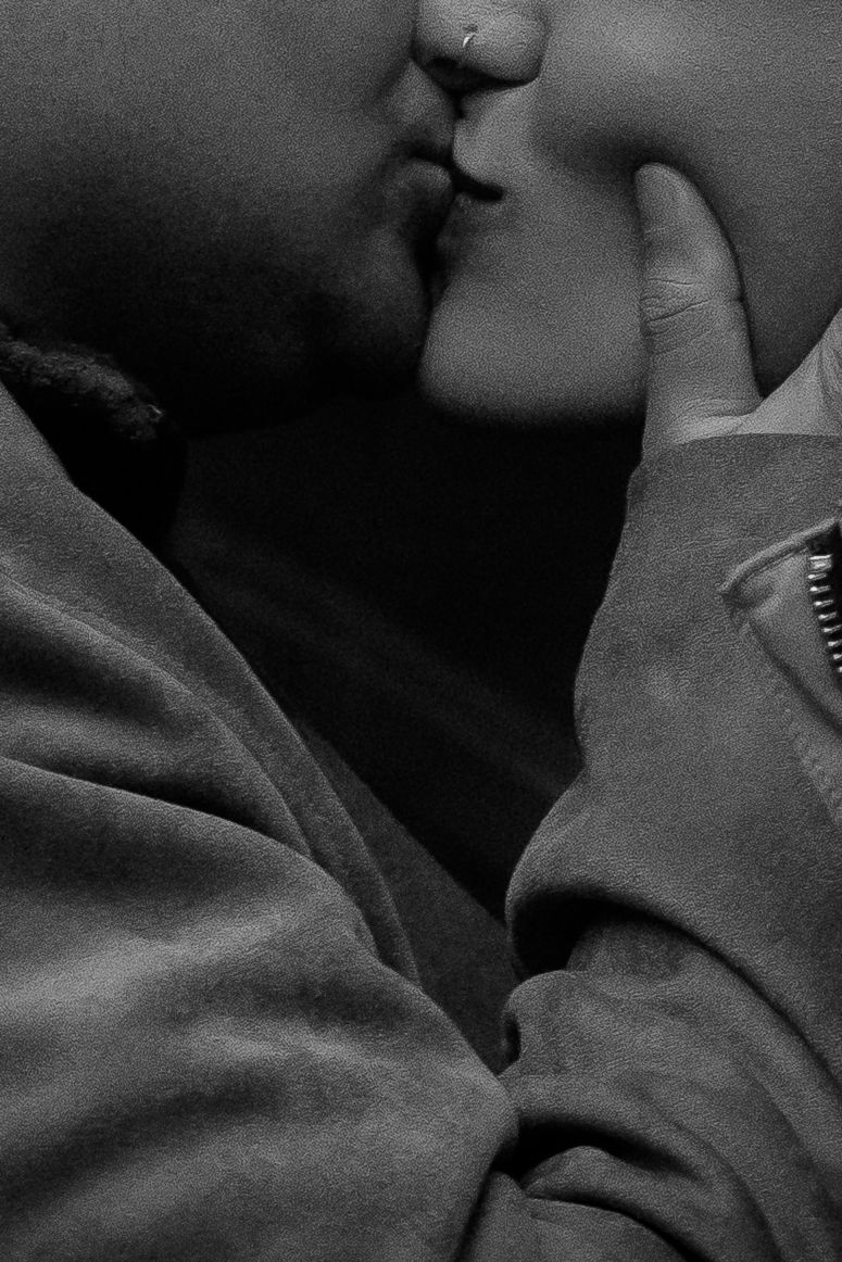 A series of black and white close-up photos showing intimate moments between two people in an artistic style.