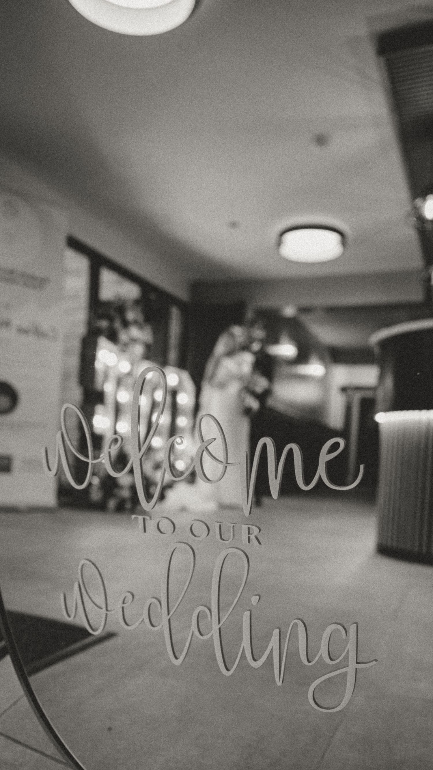 Sitwell Arms. Black and white artistic photo series showing handwritten text on glass or mirror surfaces in a dimly lit interior space.