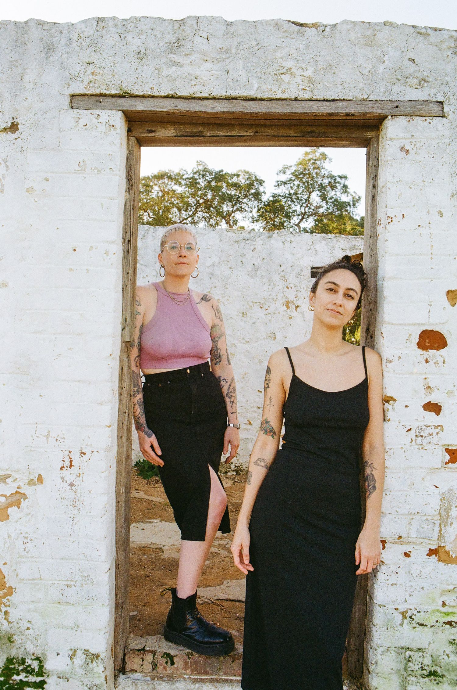 Authentic anniversary photoshoot of LGBTQ+ couple in Perth, captured on 35mm film outdoors.