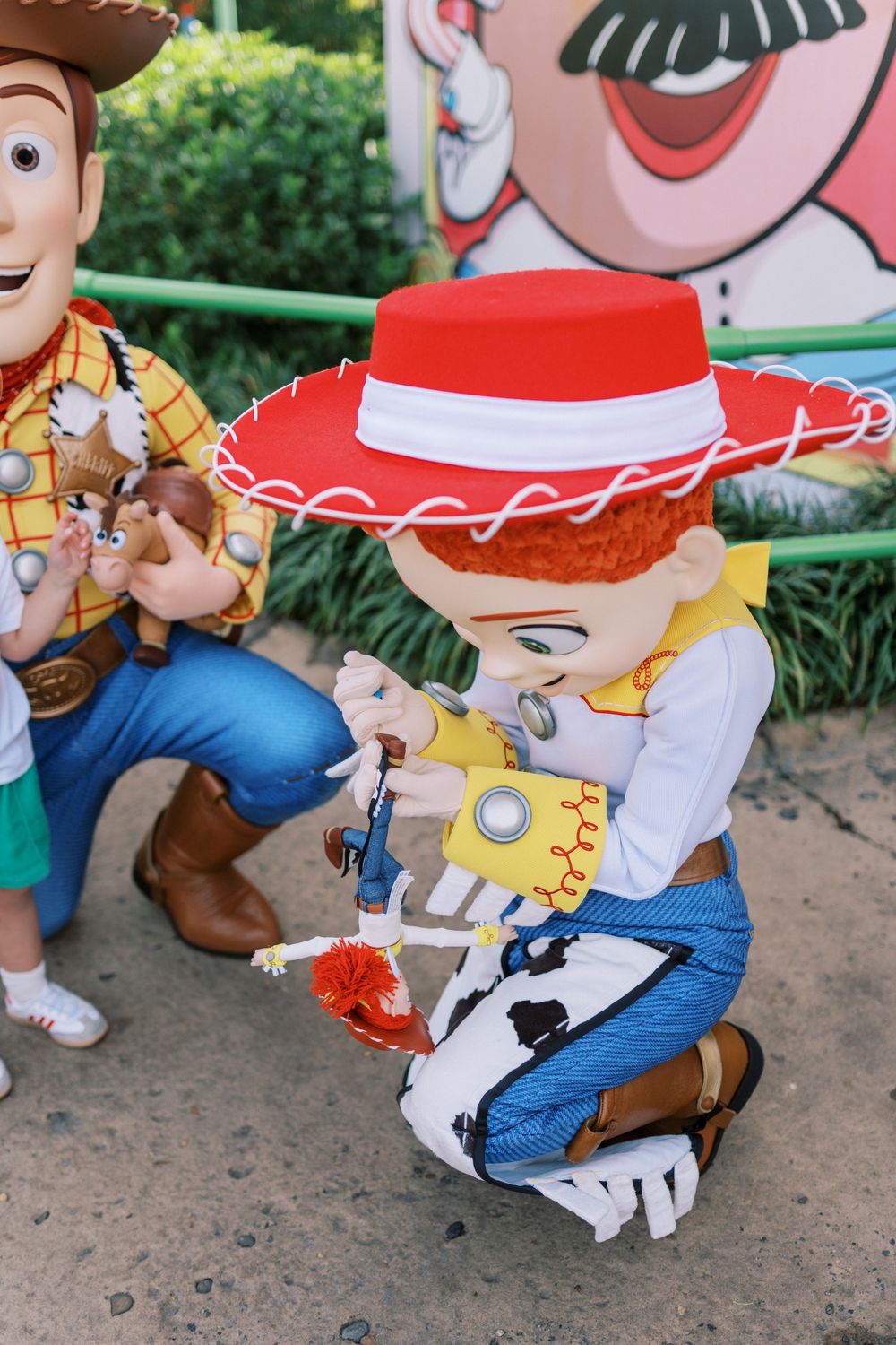 Close-up shot of Woody and Jessie characters from Toy Story in their iconic cowboy outfits.