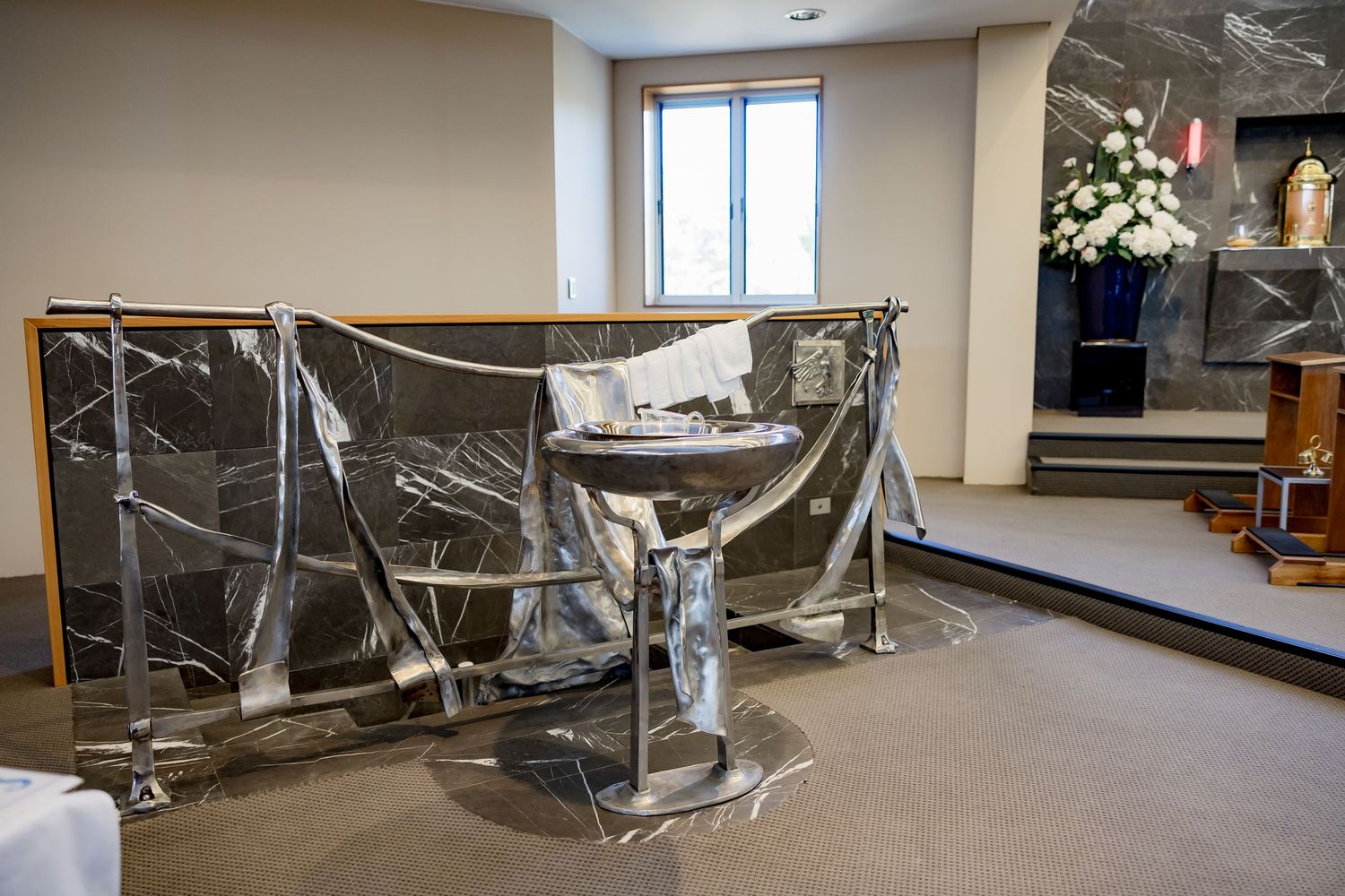 Large office space interior covered in protective plastic sheeting during renovation or construction work.