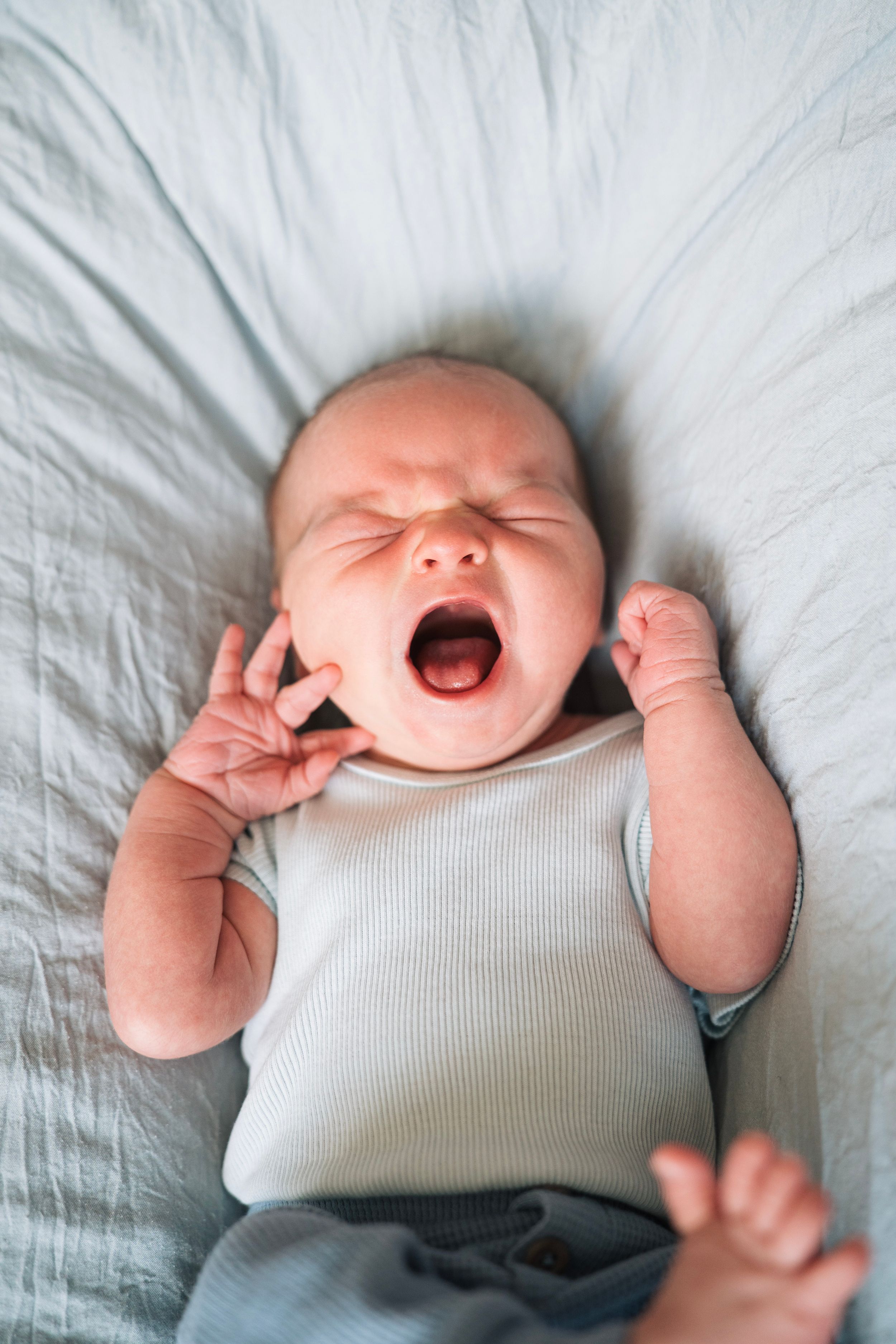 newborn baby cries during photoshoot