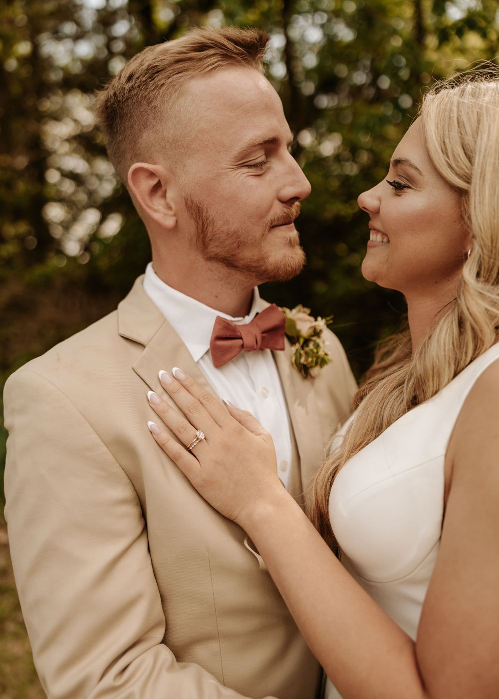 A romantic close-up series of a couple in wedding attire, with the groom in tan suit and bride in white dress.