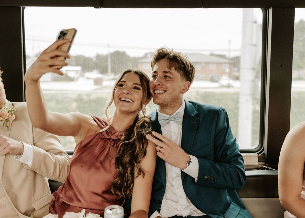 Candid moments of friends gathered around a table laughing and taking selfies.
