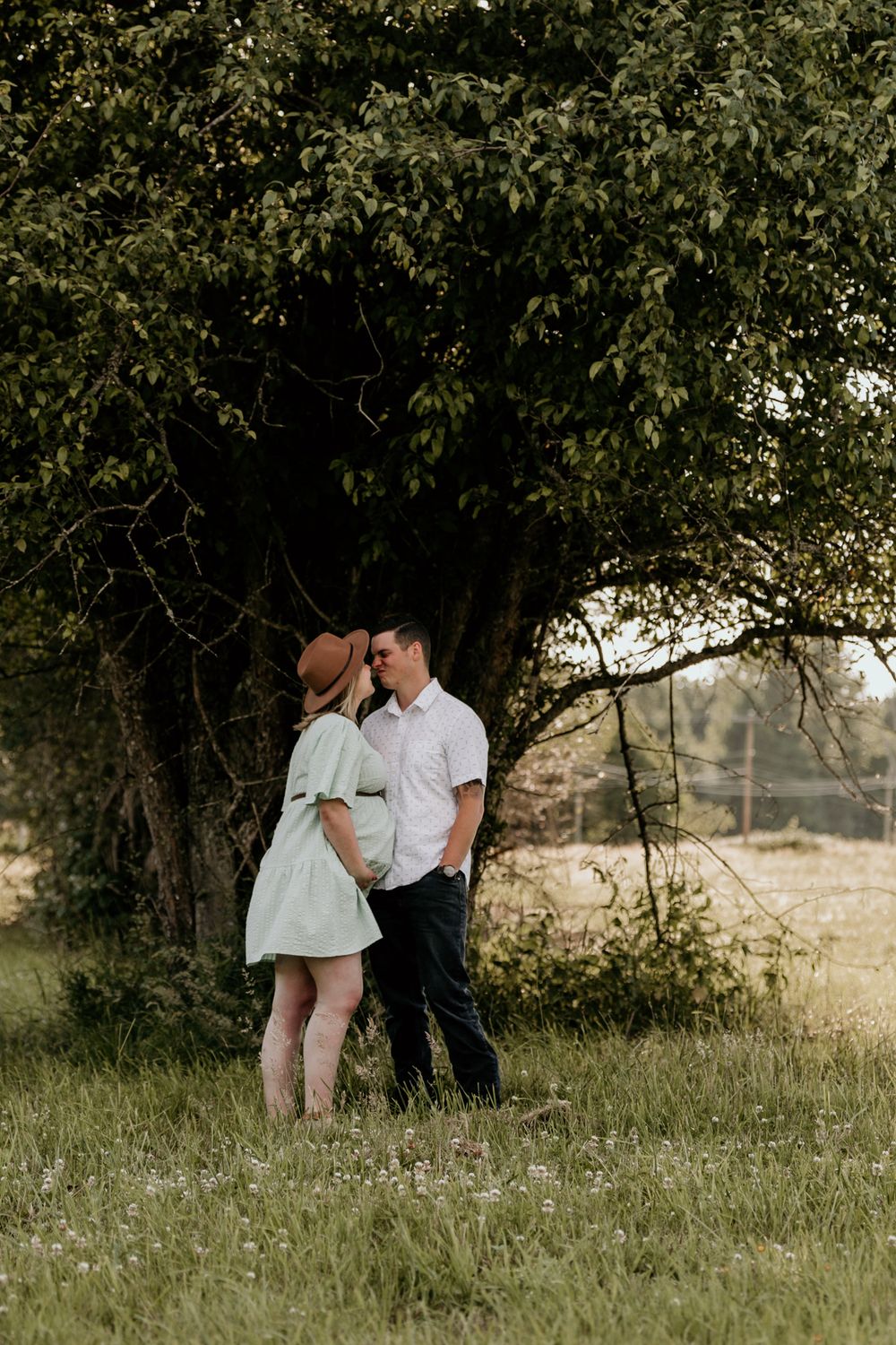 Couple holding hands at sunset | maternity photography
