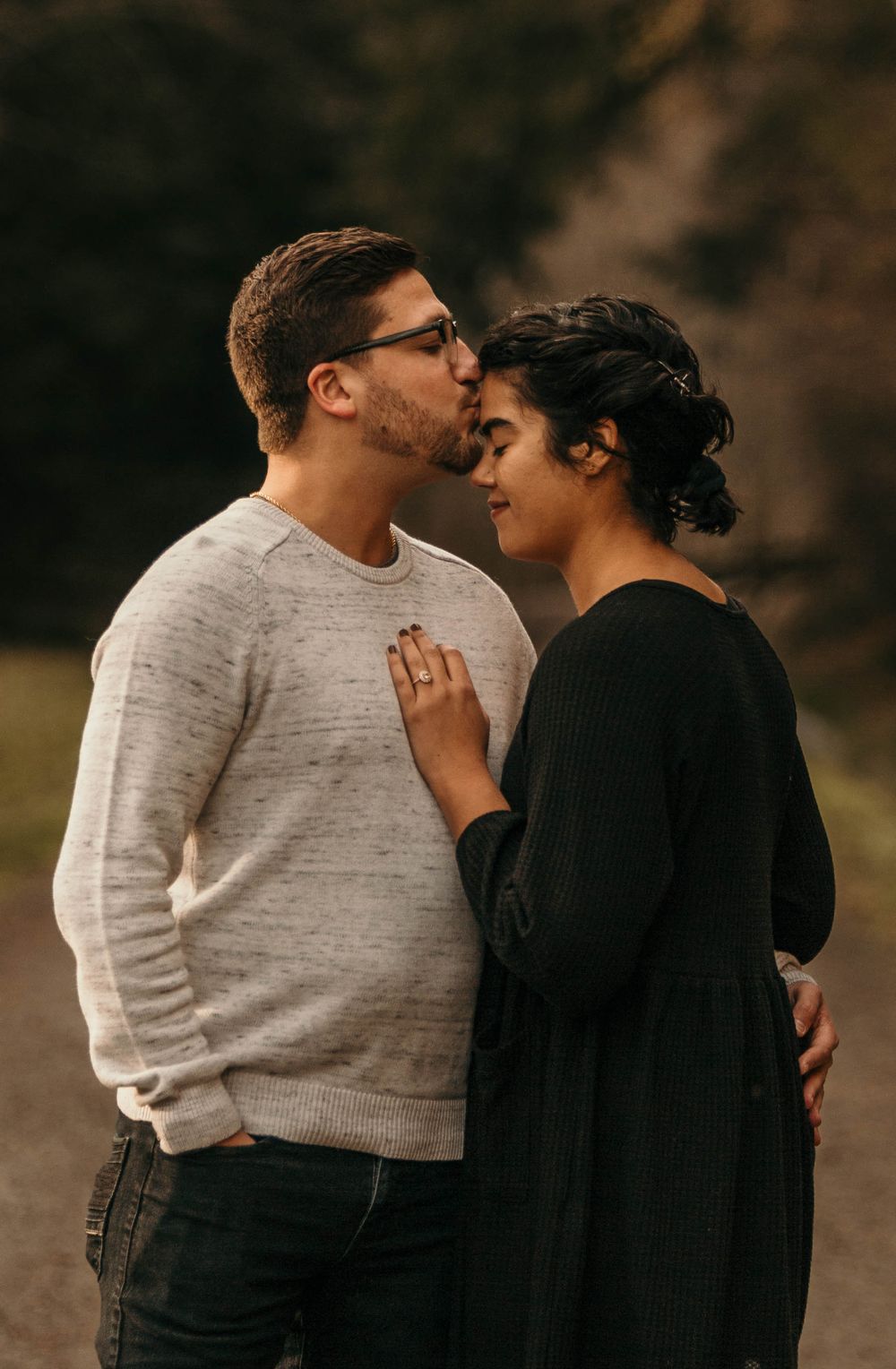 Couple holding hands at sunset | engagement photography