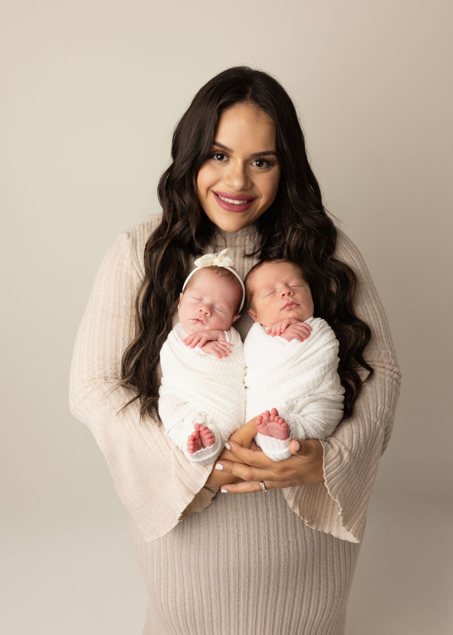 mom holds her newborn twins. Newborn Photos for Janina's Photo session Cloverdale Family Photos Elizabeth Lang Photography. Studio.