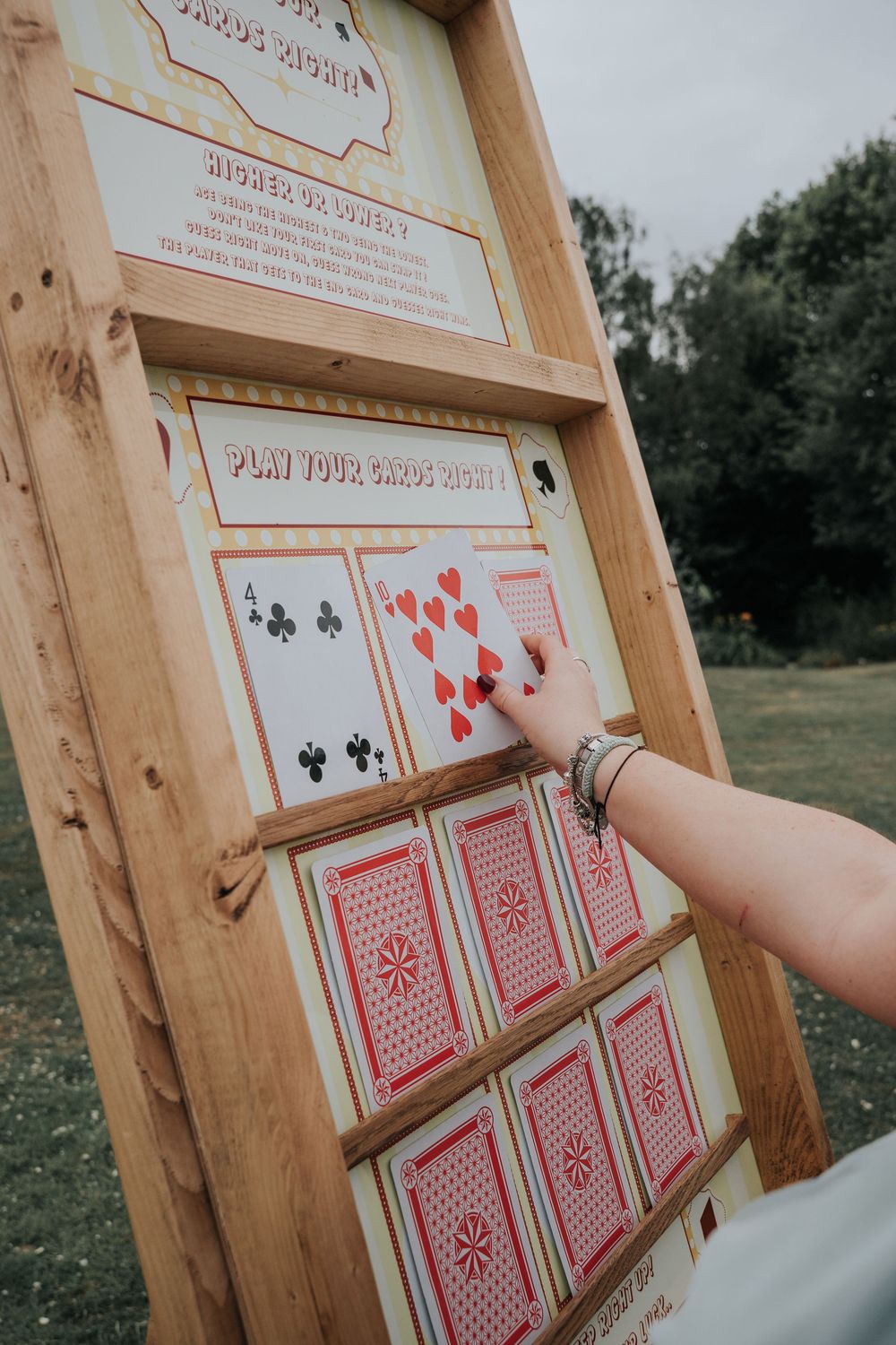 Guests playing garden games at Rockbeare Manor summer wedding