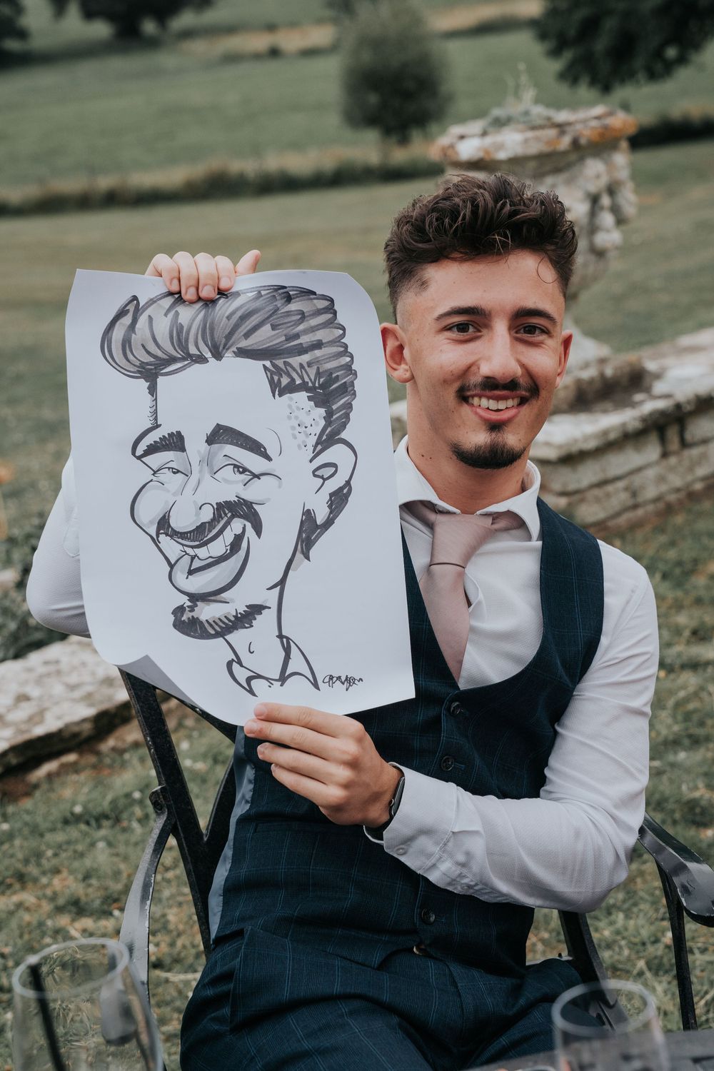 Caricaturist from Sensible Pencil drawing wedding guests outdoors