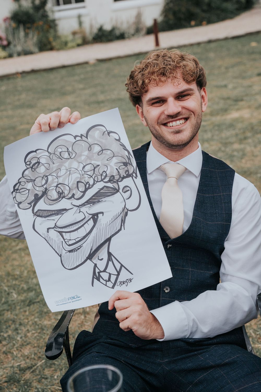 Caricaturist from Sensible Pencil drawing wedding guests outdoors
