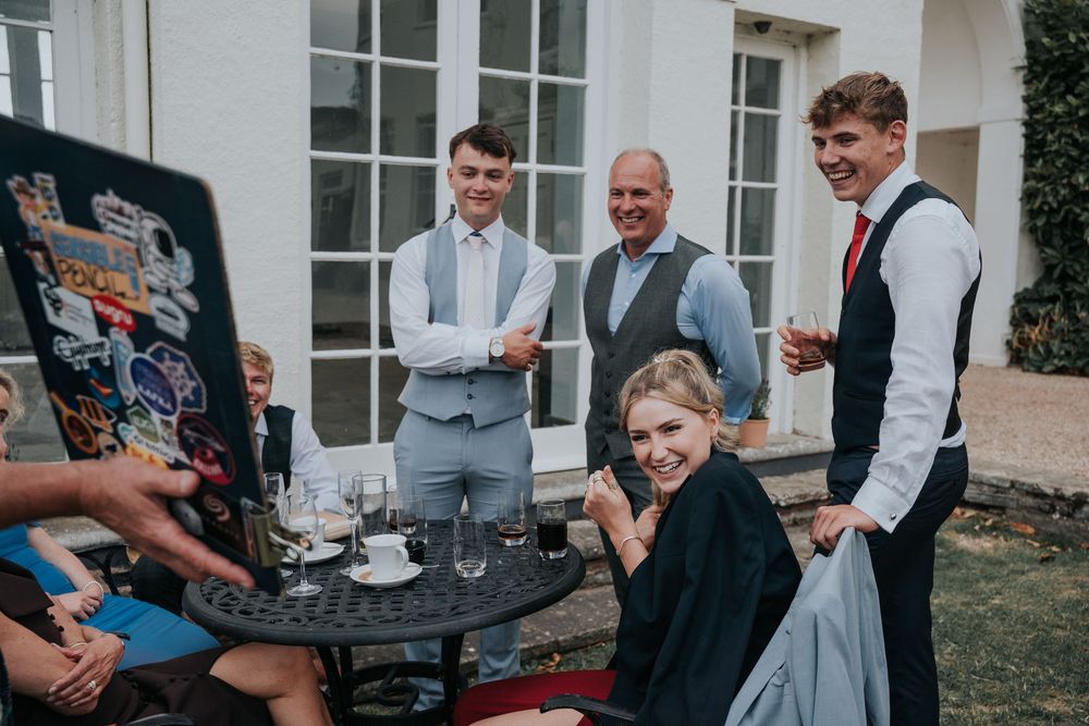 Caricaturist from Sensible Pencil drawing wedding guests outdoors