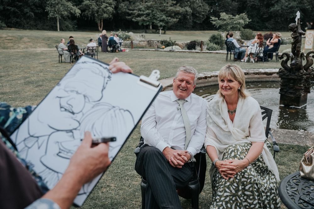 Caricaturist from Sensible Pencil drawing wedding guests outdoors